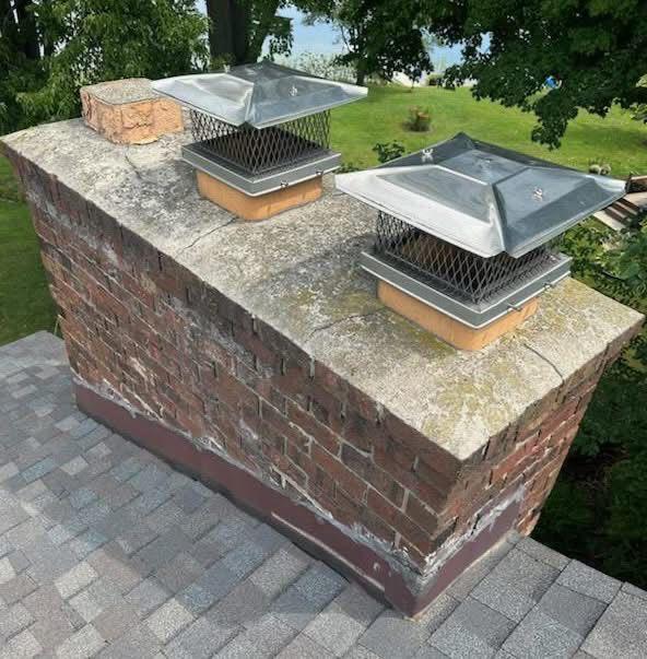 Double-flue chimney with a cracked, weathered crown